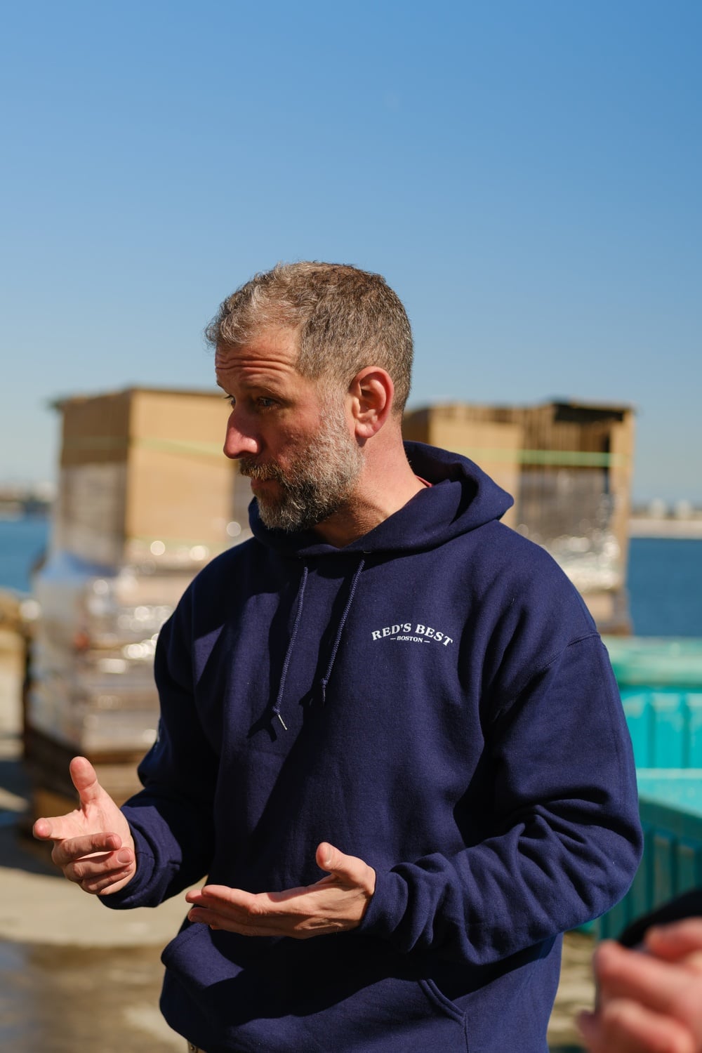 Jared Auerbach stands at the end of the Boston Fish Pier.