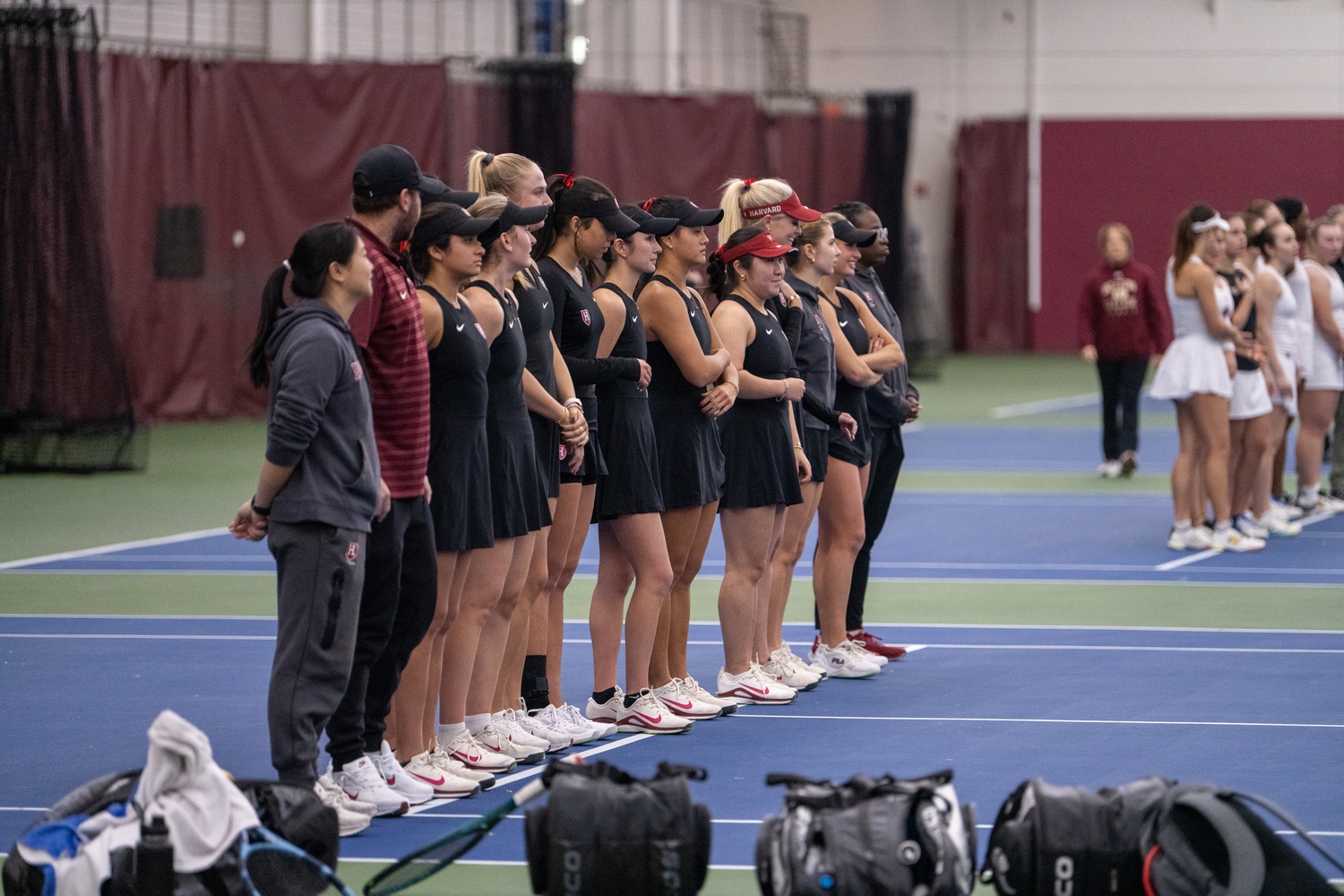 The Harvard women's tennis team lines up before its match against Boston College earlier this season.