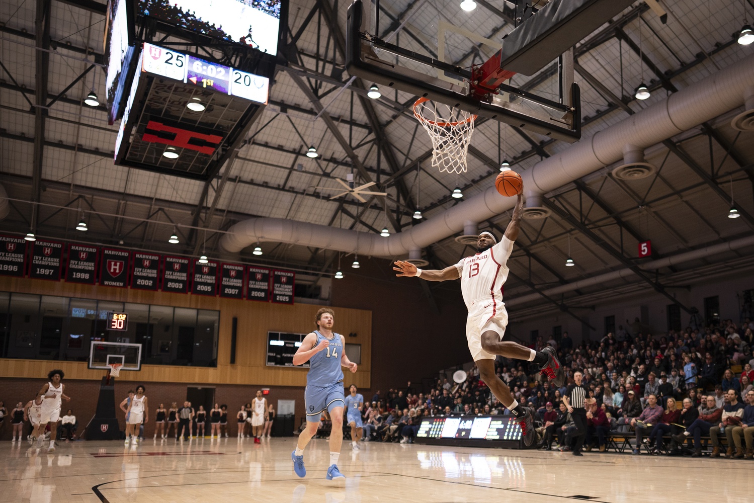Captain Chandler Piggé drives to the hoop against Columbia.