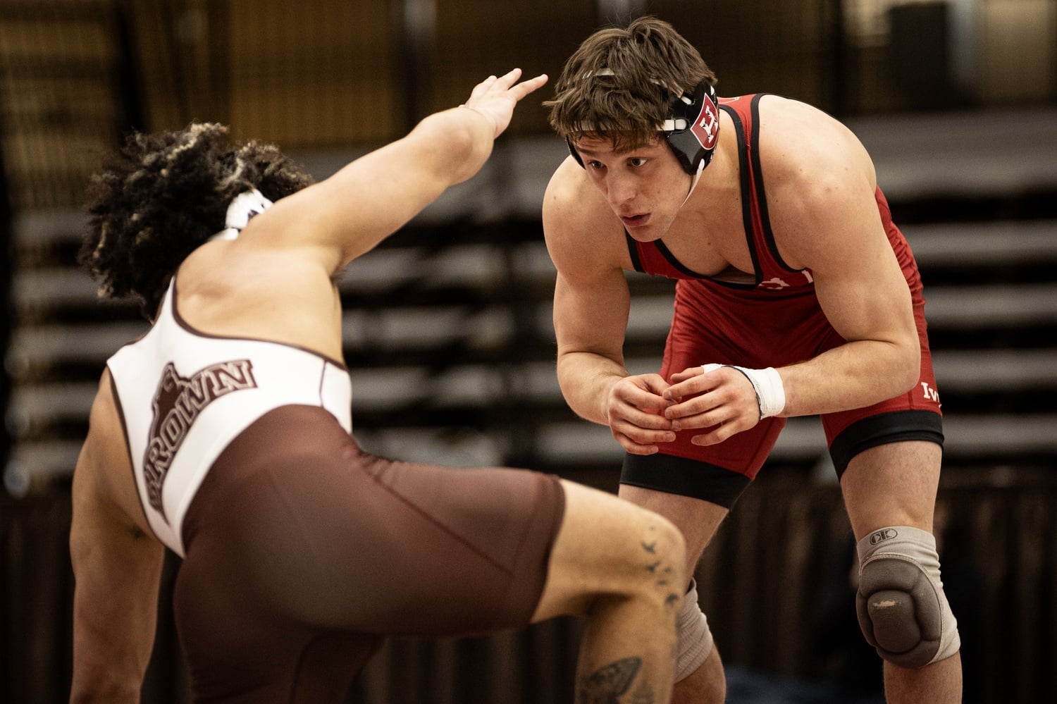 Captain Jimmy Harrington faces off against a Brown opponent.