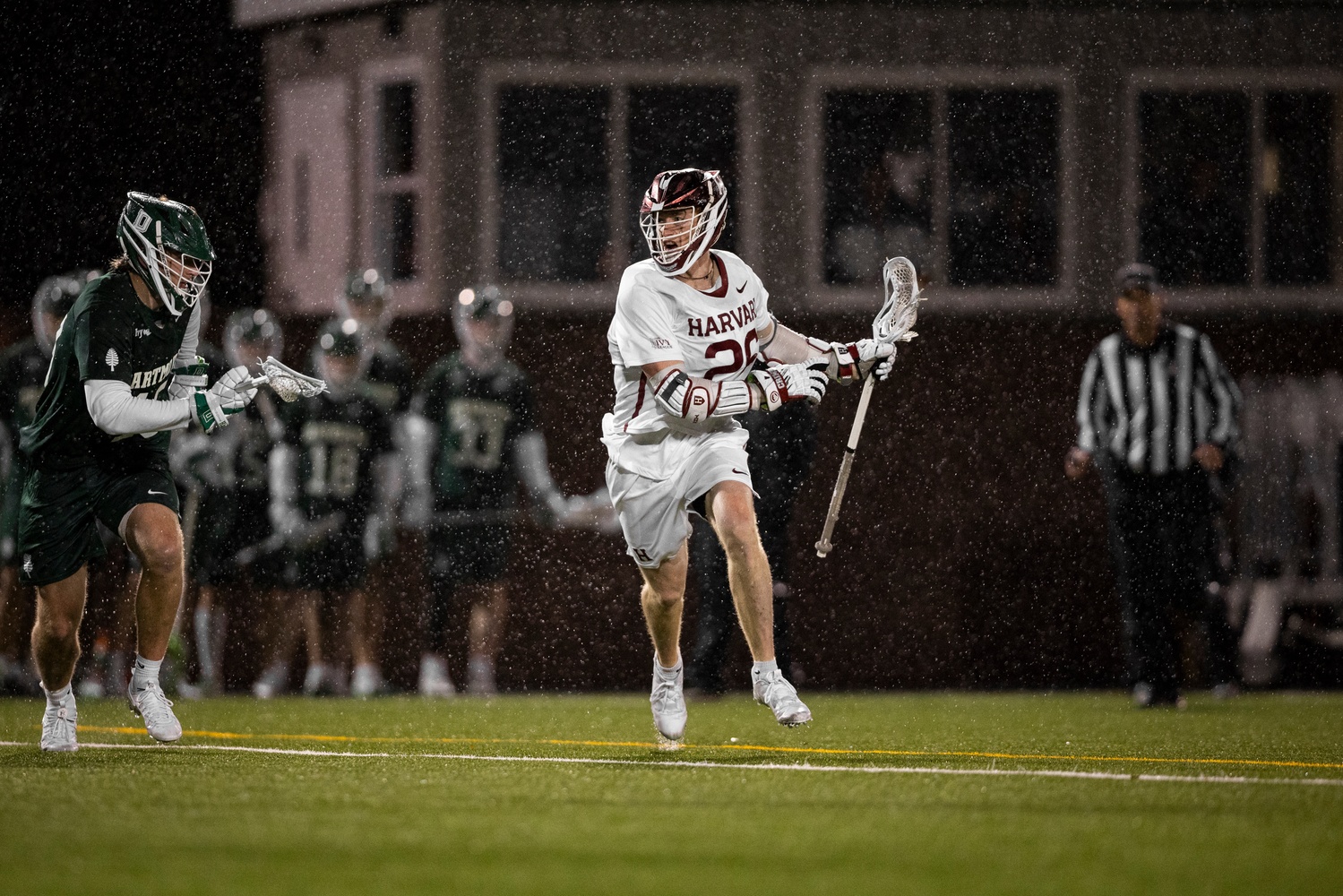 Senior attack Teddy Malone on the attack for Harvard on a night he joined the prestigious 100-goal club.