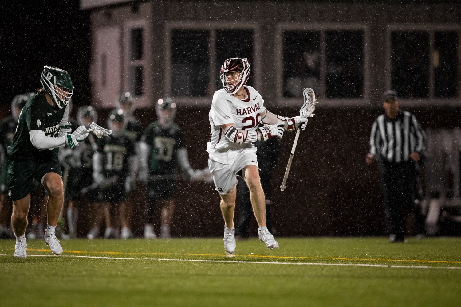 Senior attack Teddy Malone on the attack for Harvard on a night he joined the prestigious 100-goal club.