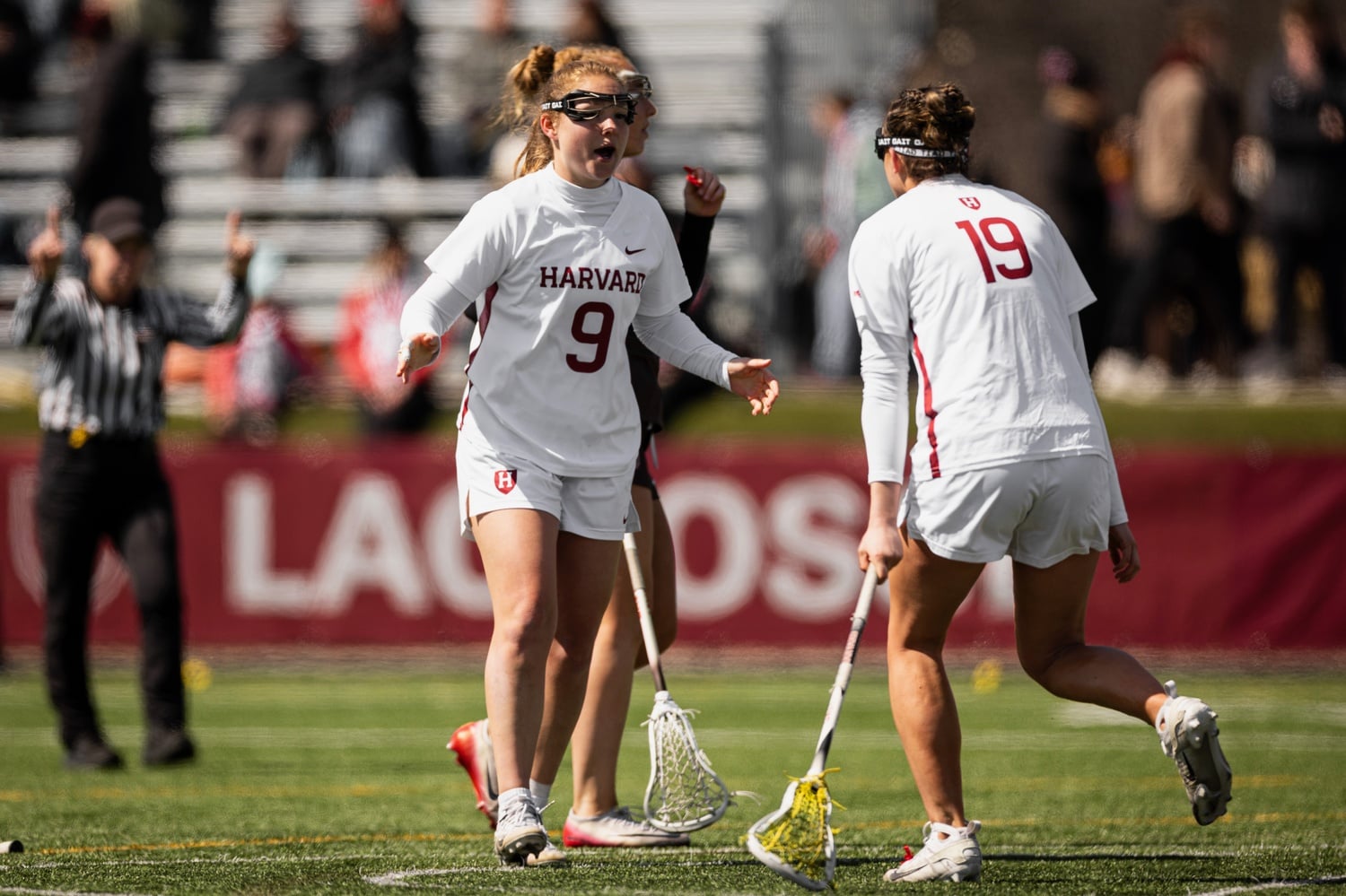 Captain Kate Gilliam and sophomore midfielder Tori Balser celebrate a goal against the Brown Bears. 