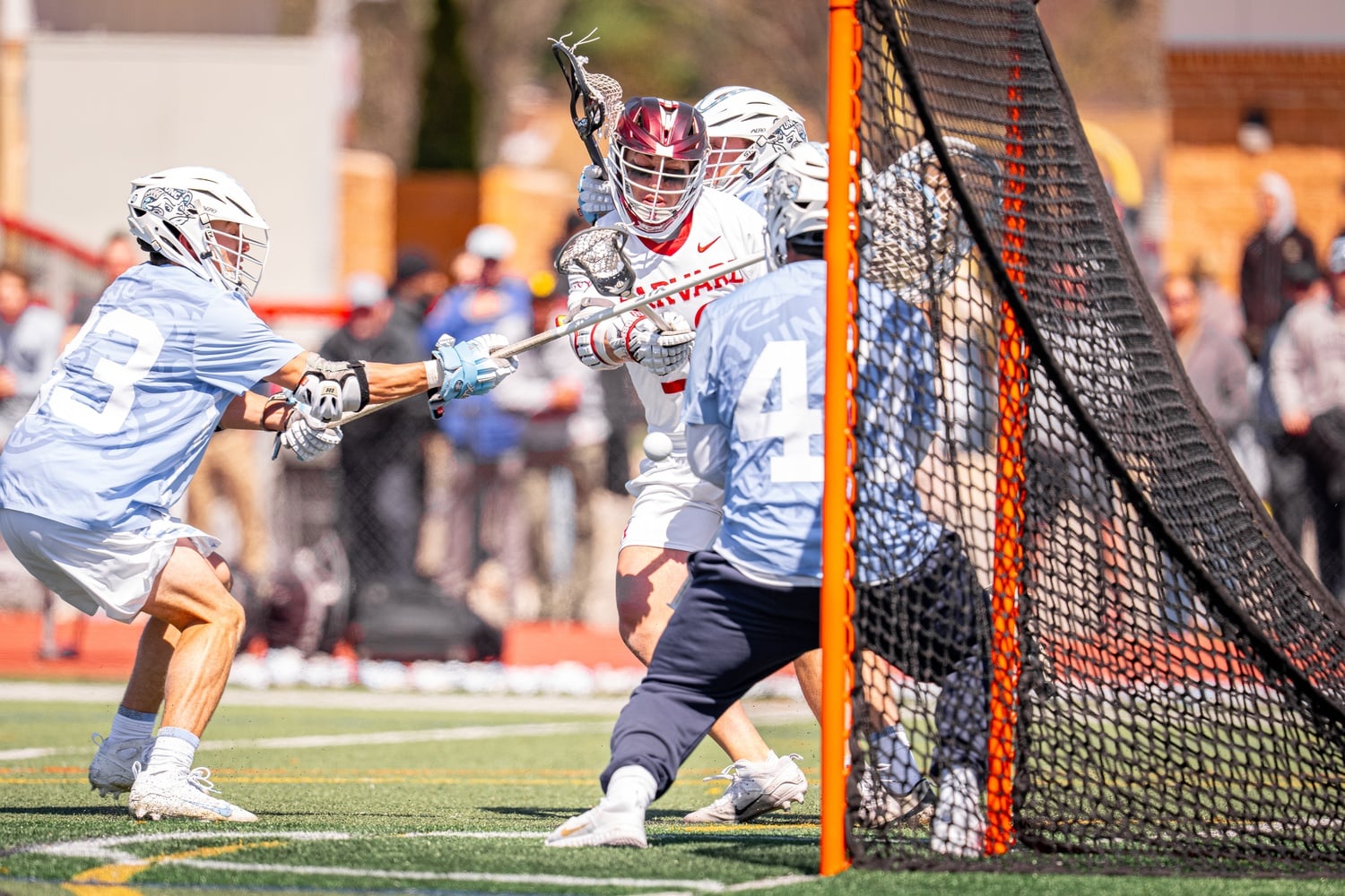 A Harvard player shoots the ball against UNC.