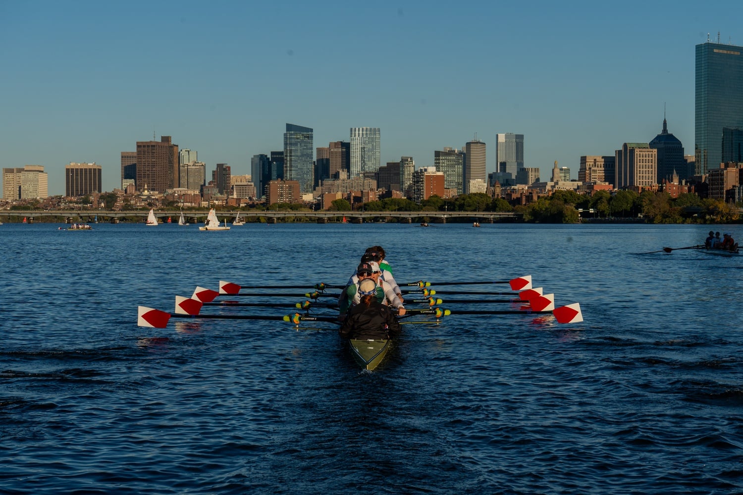 The crew team practices in the Charles River.