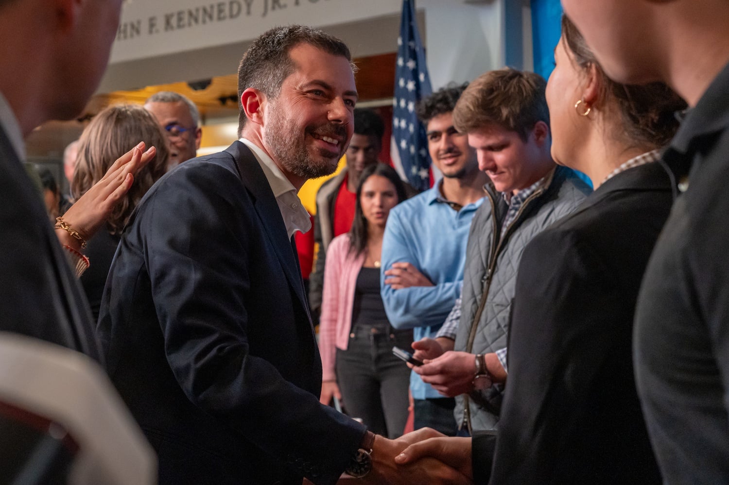 Former Secretary of Transportation Pete P.M. Buttigieg '04 greets students after speaking during a forum at the Institute of Politics. He appeared to hint at a potential presidential run during the Monday forum.