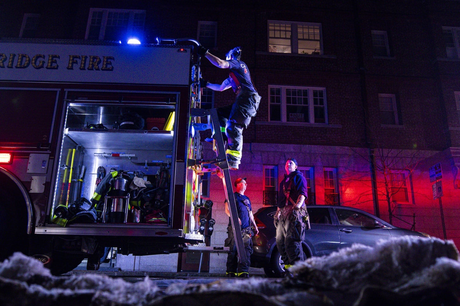 A firefighter descends a ladder outside Randolph Hall after an early Sunday morning fire that involved a burnt mattress.