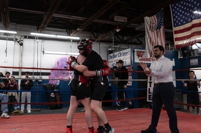 Cover image for Hugs at the end of Harvard Boxing Club's Fight Night