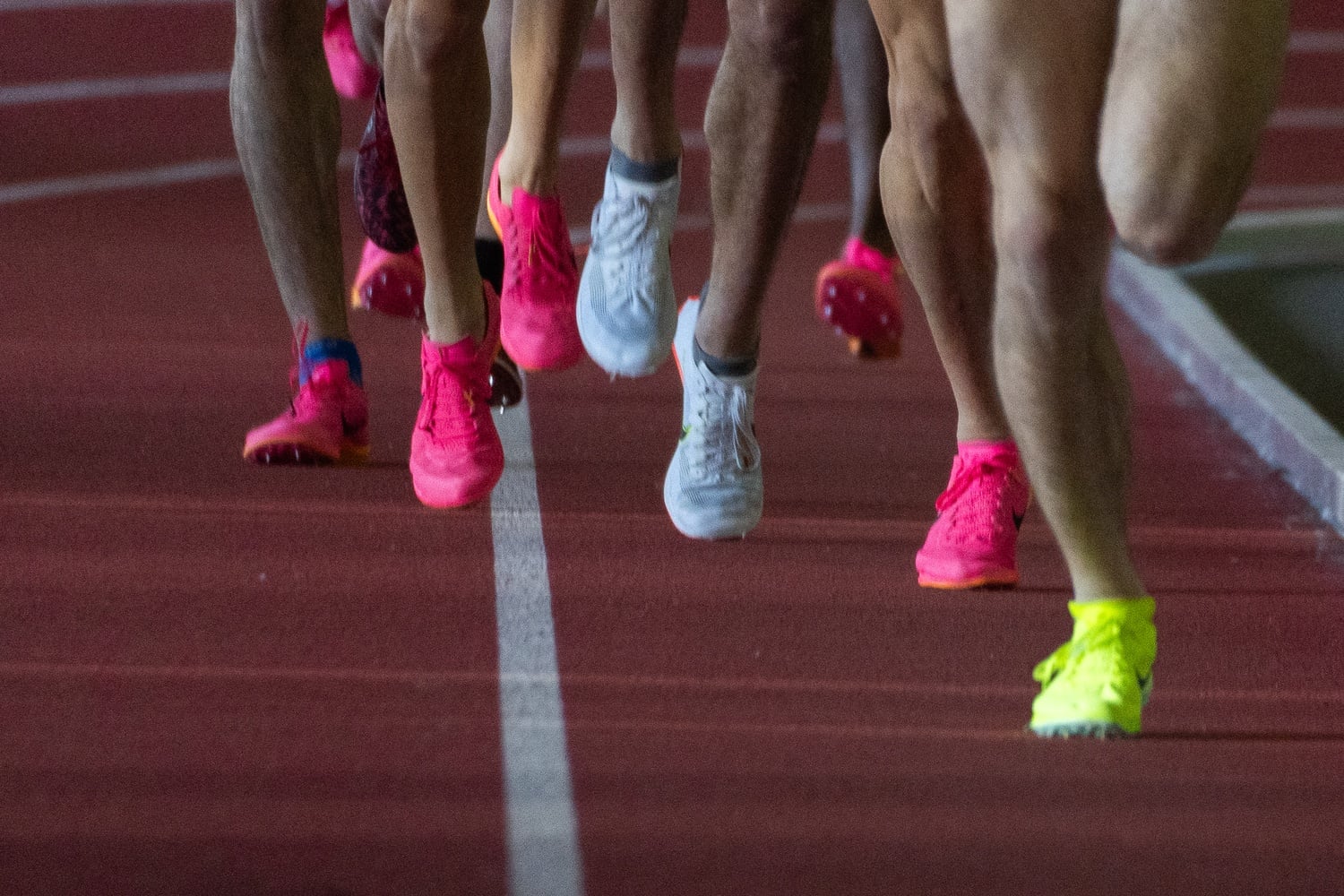 Runners round the turn at Harvard's Gordon Track. This weekend, the Crimson's two cross country teams raced at the Indiana State Invite and the Dartmouth Invite.