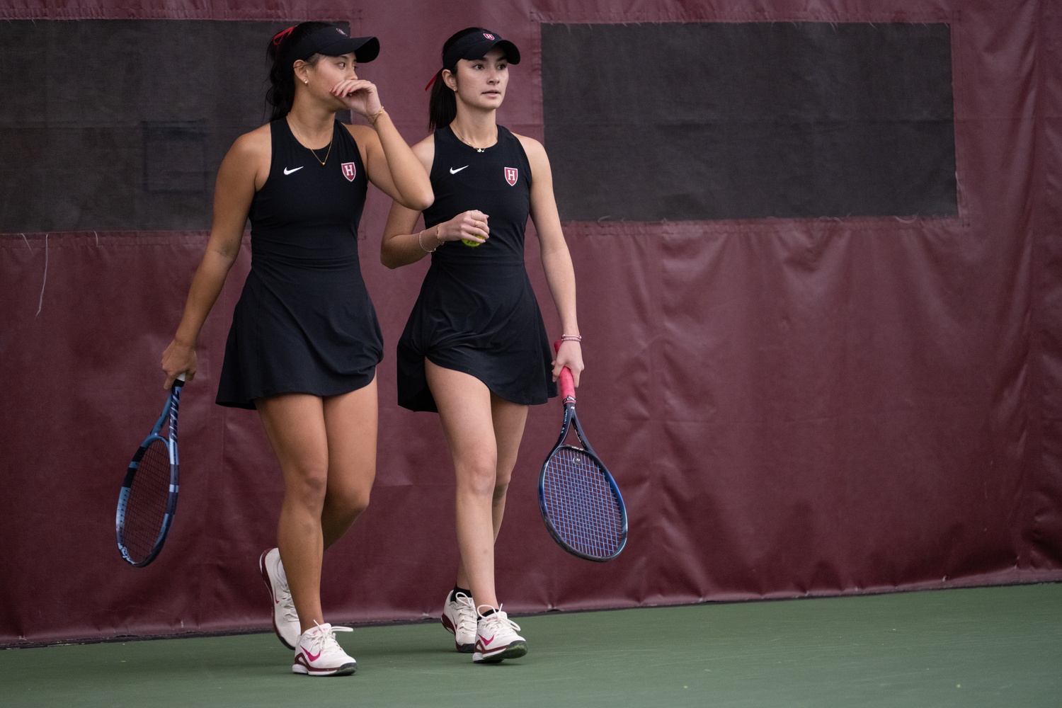 Freshman Claire Shao and junior Natalie Block convene on the court during their match against Boston College.
