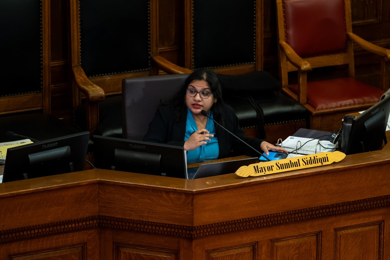 Cambridge Mayor Sumbul Siddiqui sits in Sullivan Chamber at Cambridge City Hall. Siddiqui endorsed Daniel A. Lander '14 in his state Senate campaign Tuesday.