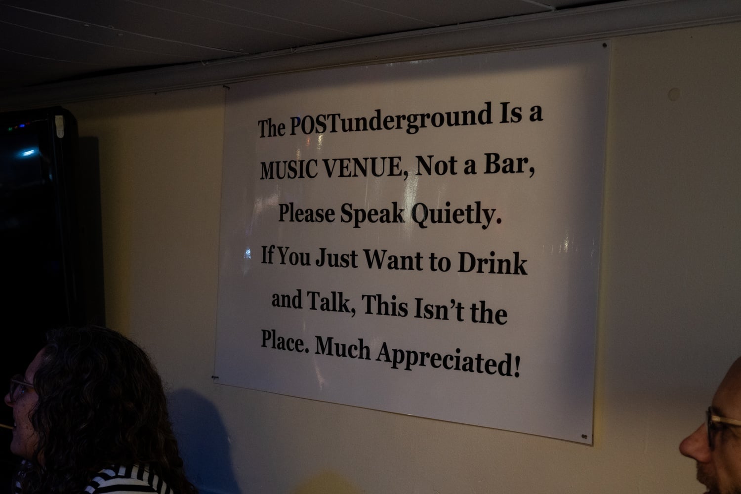 The POSTunderground hangs large signs emphasizing that it is a music venue, not a bar.
