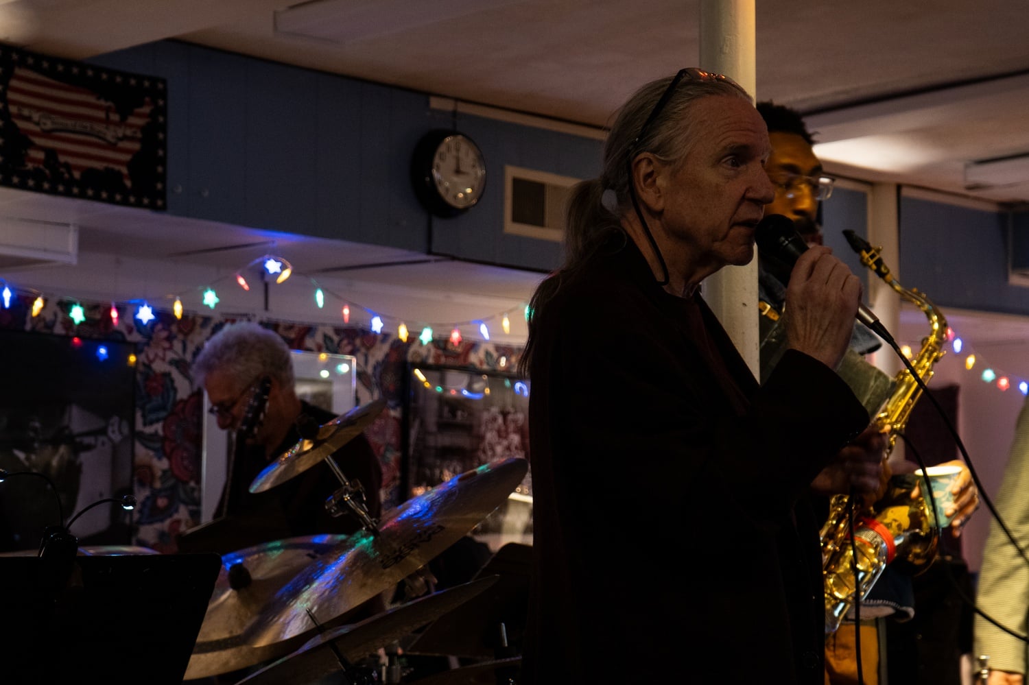 John Purcell speaks between sets at the POSTunderground.