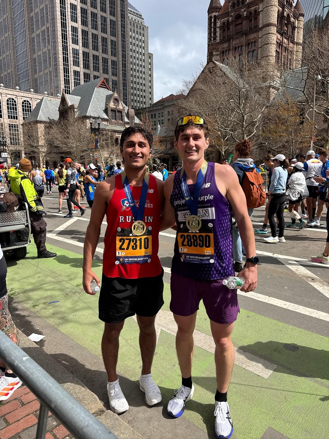 Seniors Ethan Veghte and Rustin Khosravi after the 130th Boston Marathon.