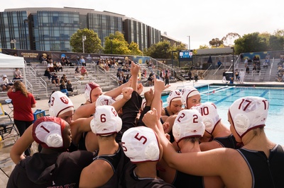 Cover image for Women's Water Polo Team Huddle