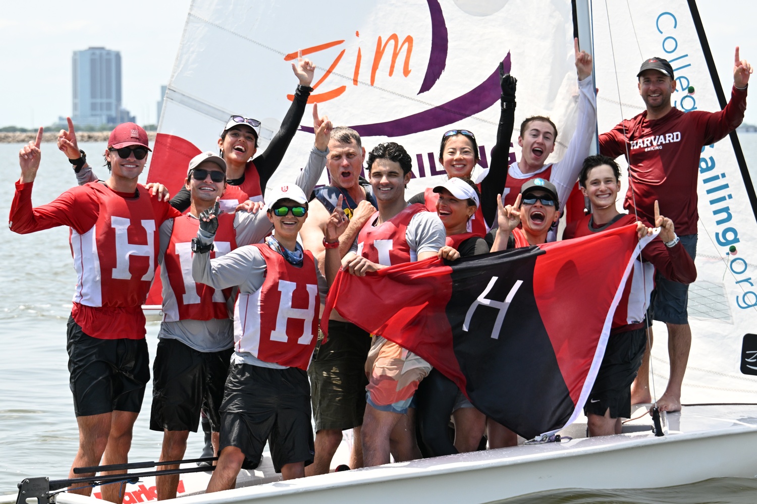 The Harvard Crimson sailing team celebrates after winning the ICSA Open Team Racing National Championship.