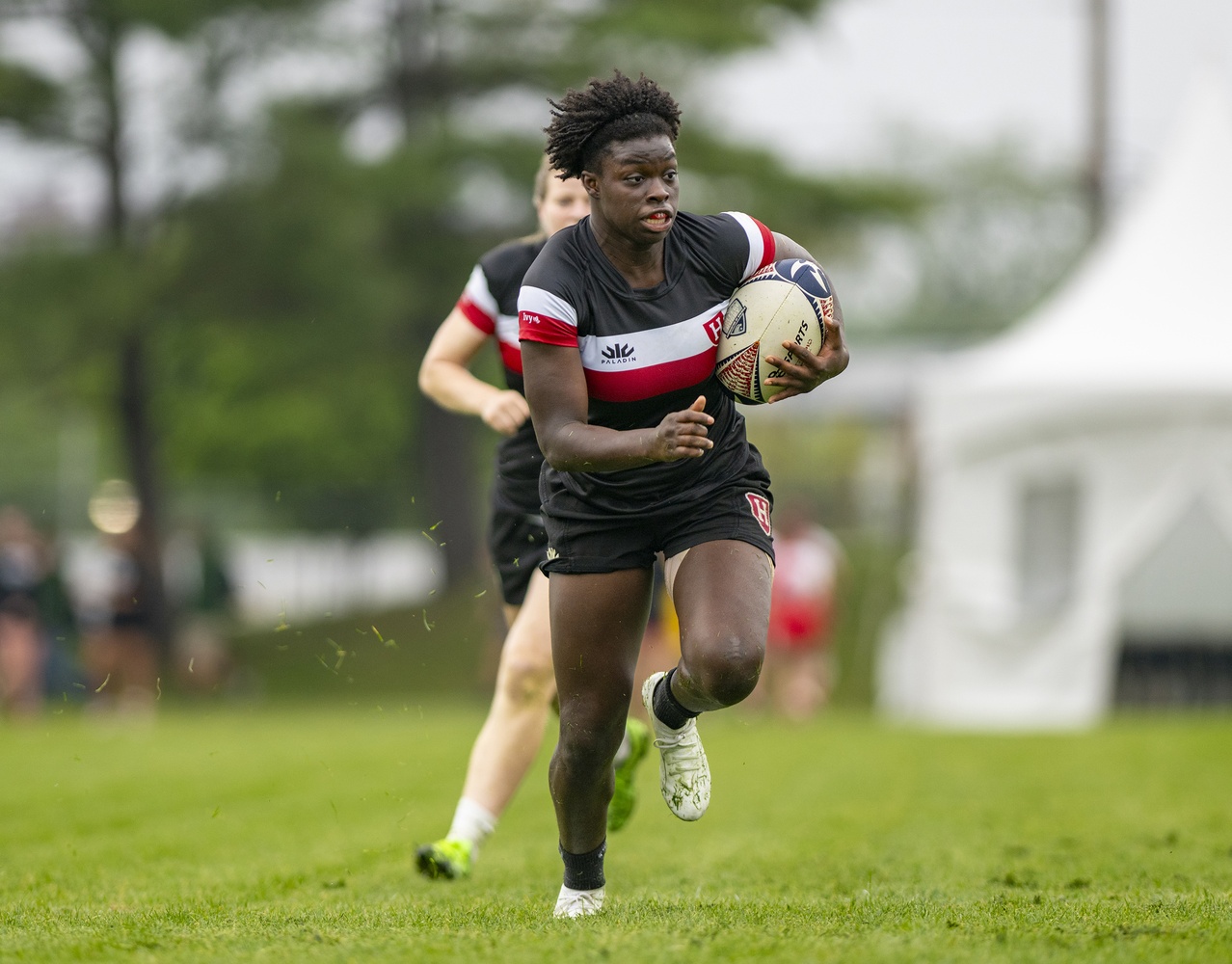 Freshman Sana'a Lunon sprints toward the line during the 2026 Women's National 7s College Rugby Championship Tournament. 