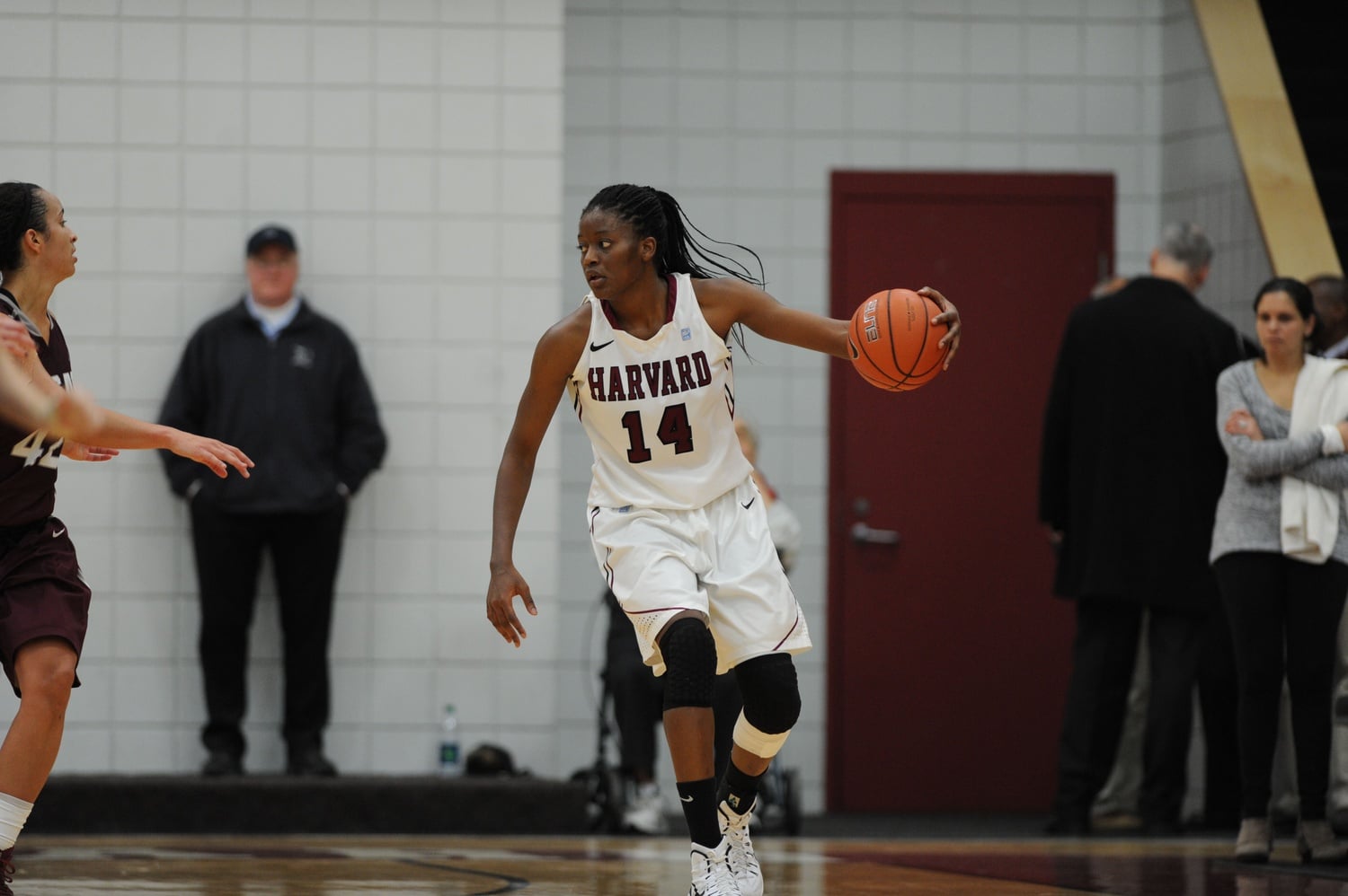 Temi Fagbenle ’15 dribbles during a Harvard basketball game. 