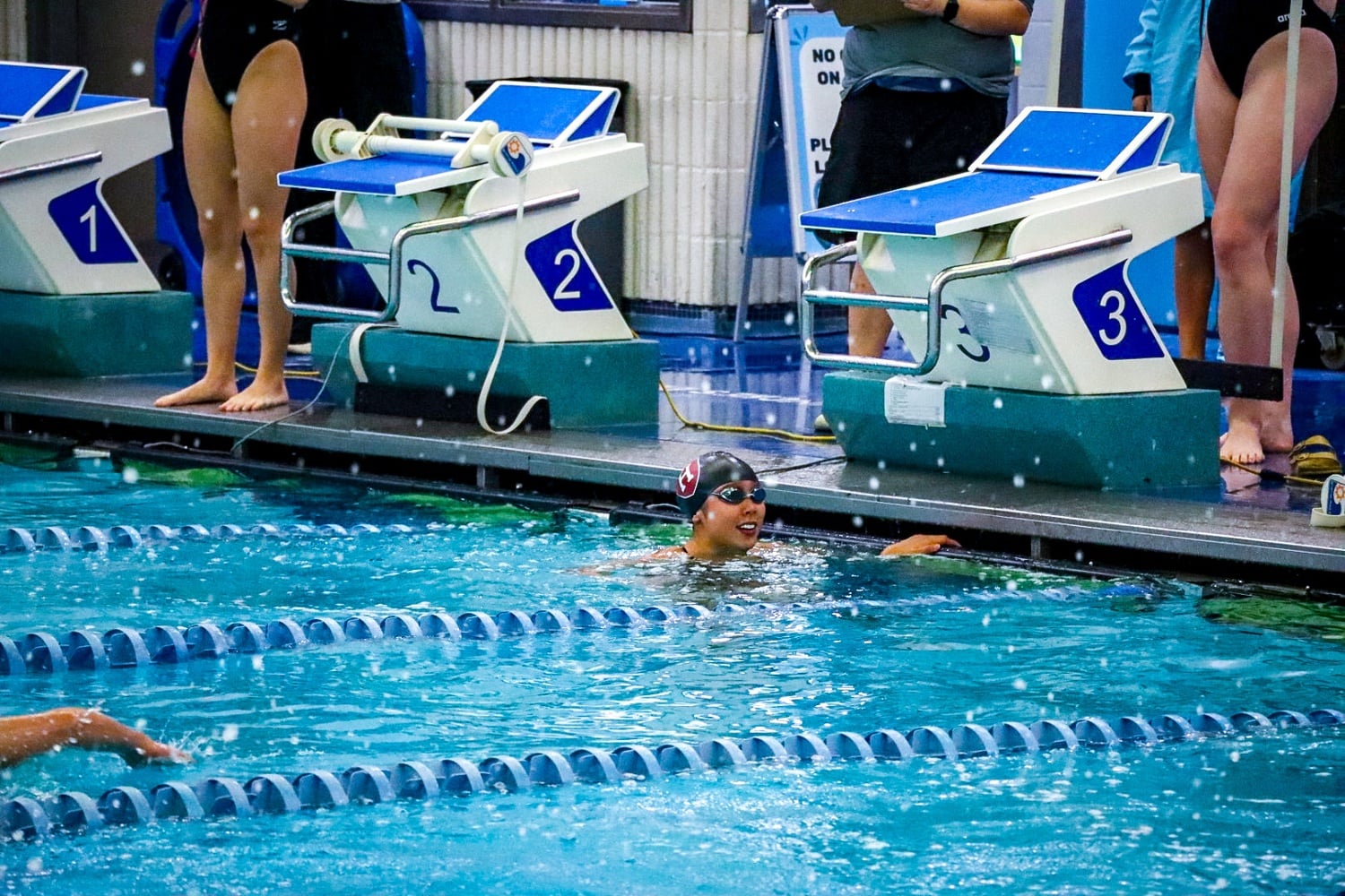 Sydney Lu finishes a race during her strong senior season.