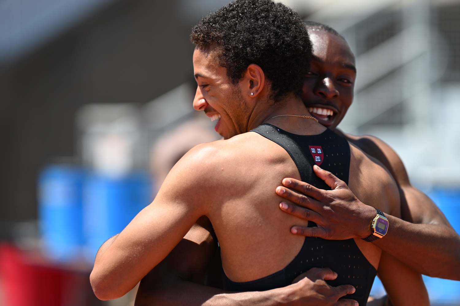 Junior Timi Esan and sophomore LeRoy Horton hug after a race.