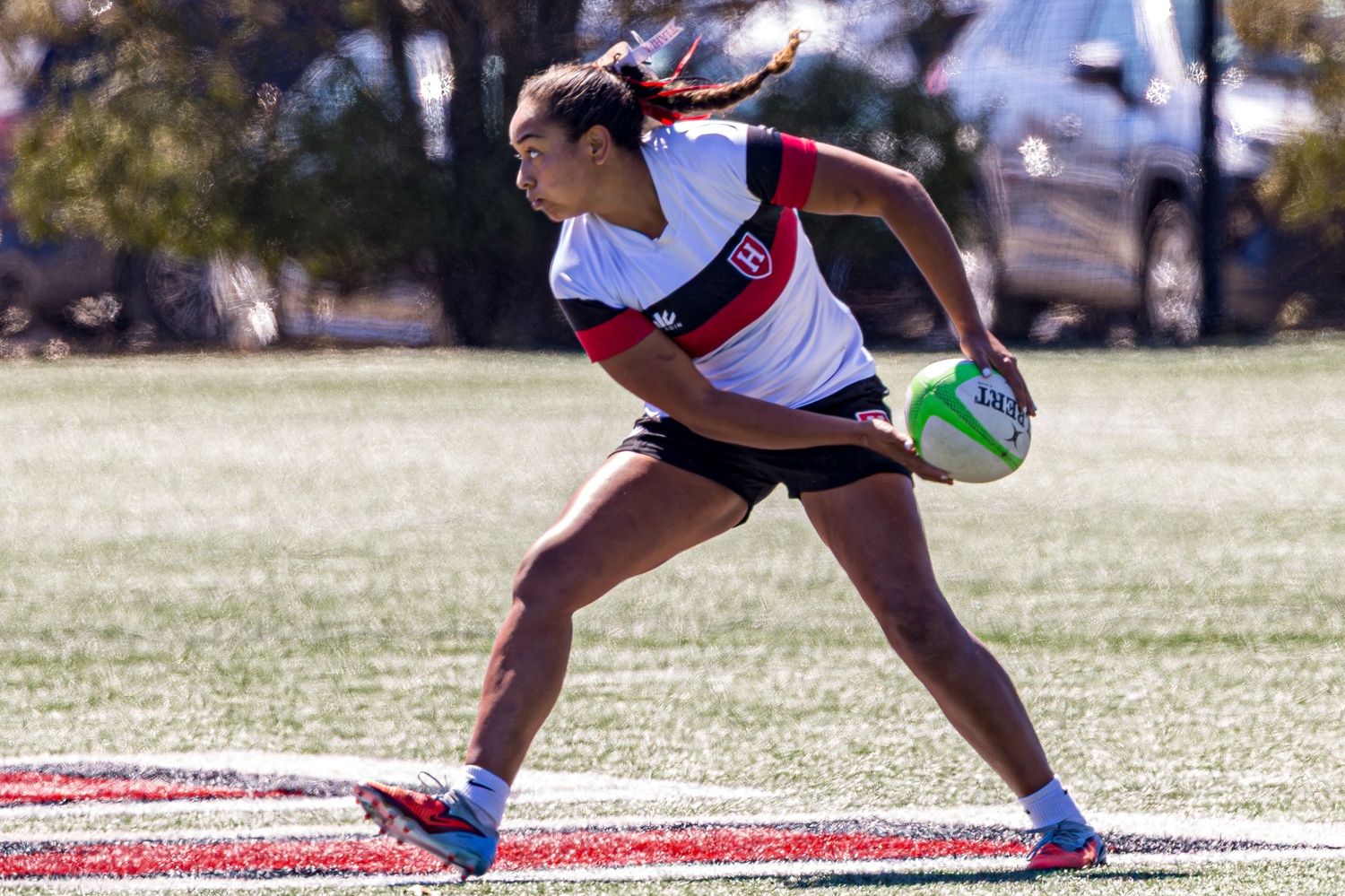 Padilla passes the rugby ball during the 2026 Ivy 7s Championships. The team took home first at the competition.