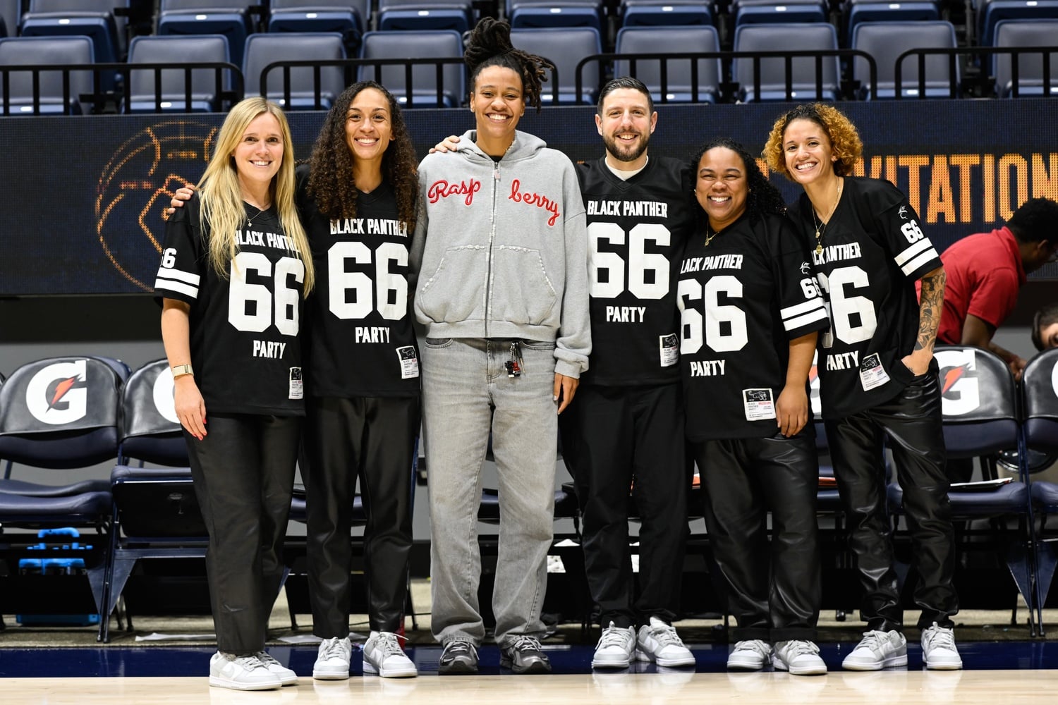 The women's basketball coaching staff wears their Black Panther jerseys at the Raising the B.A.R. Invitational.