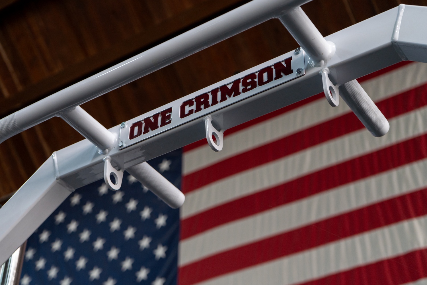 The "One Crimson" slogan affixed to Harvard's weightlifting equipment.