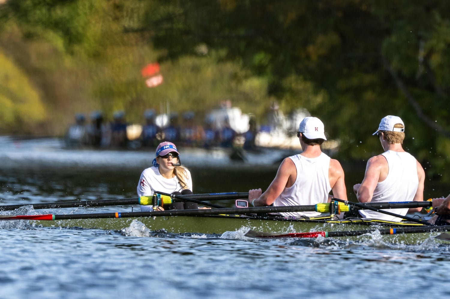 Senior coxswain Sylvie Spitz guides the crew down the Charles River.