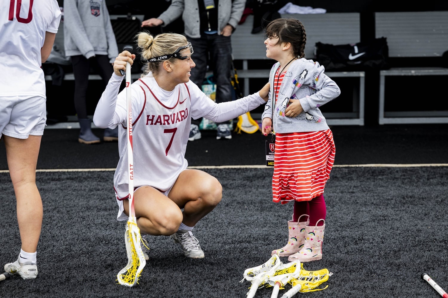 Junior Natasha Tribolet and Tilly on the sideline at Jordan Field. 