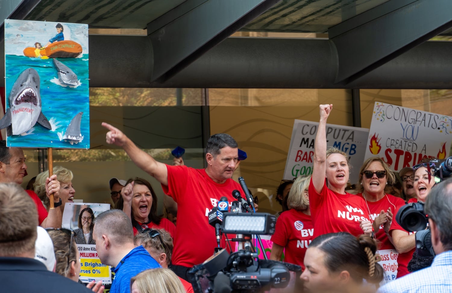 Brigham MNA Bargaining Committee members speak at a noon rally. More than 4,000 nurses at the Brigham and Women's Hospital began a one-day strike Wednesday morning, calling for wage increases and lower healthcare costs.