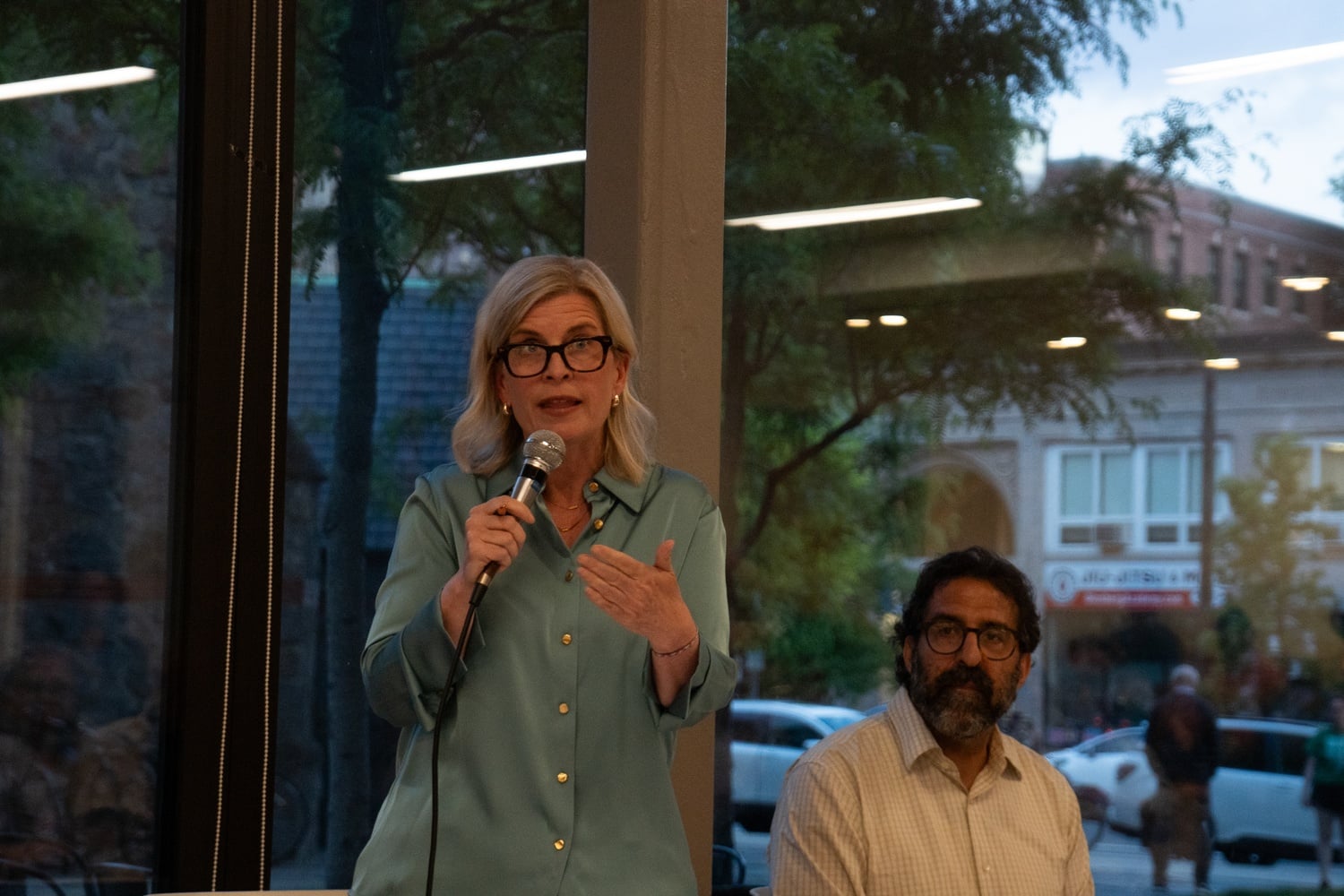 State Rep. Marjorie C. Decker speaks at a debate against challenger Evan C. MacKay '19 in May. Decker declined during the debate to detail her work for Berman Tabacco, where she has earned at least $100,001 annually since 2016.