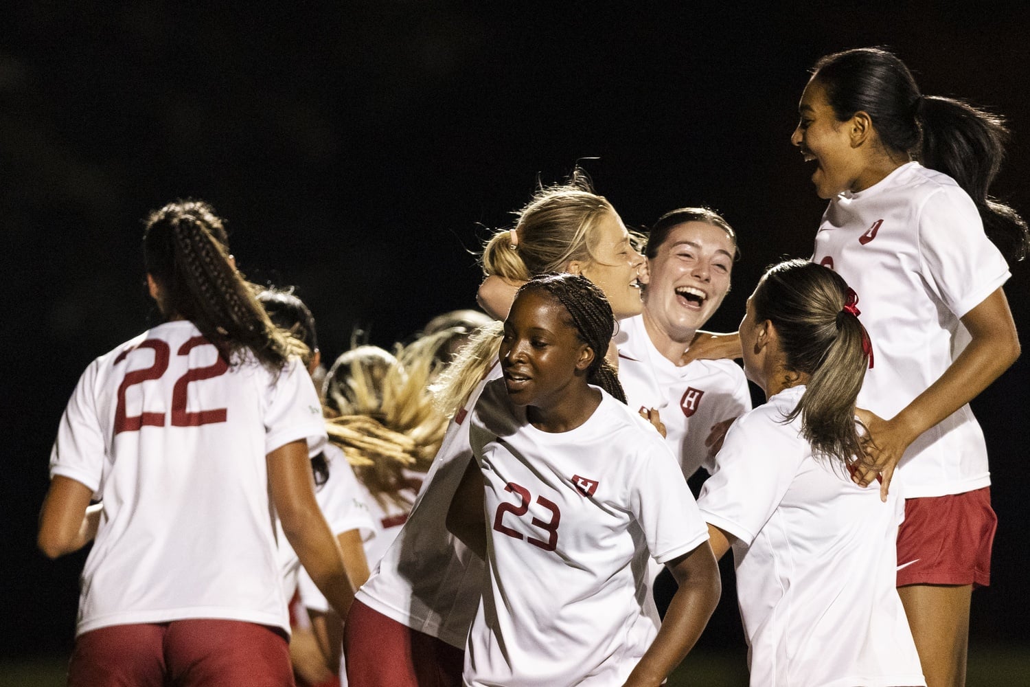 The women's soccer team celebrates after defeating Boston University in 2025. 
