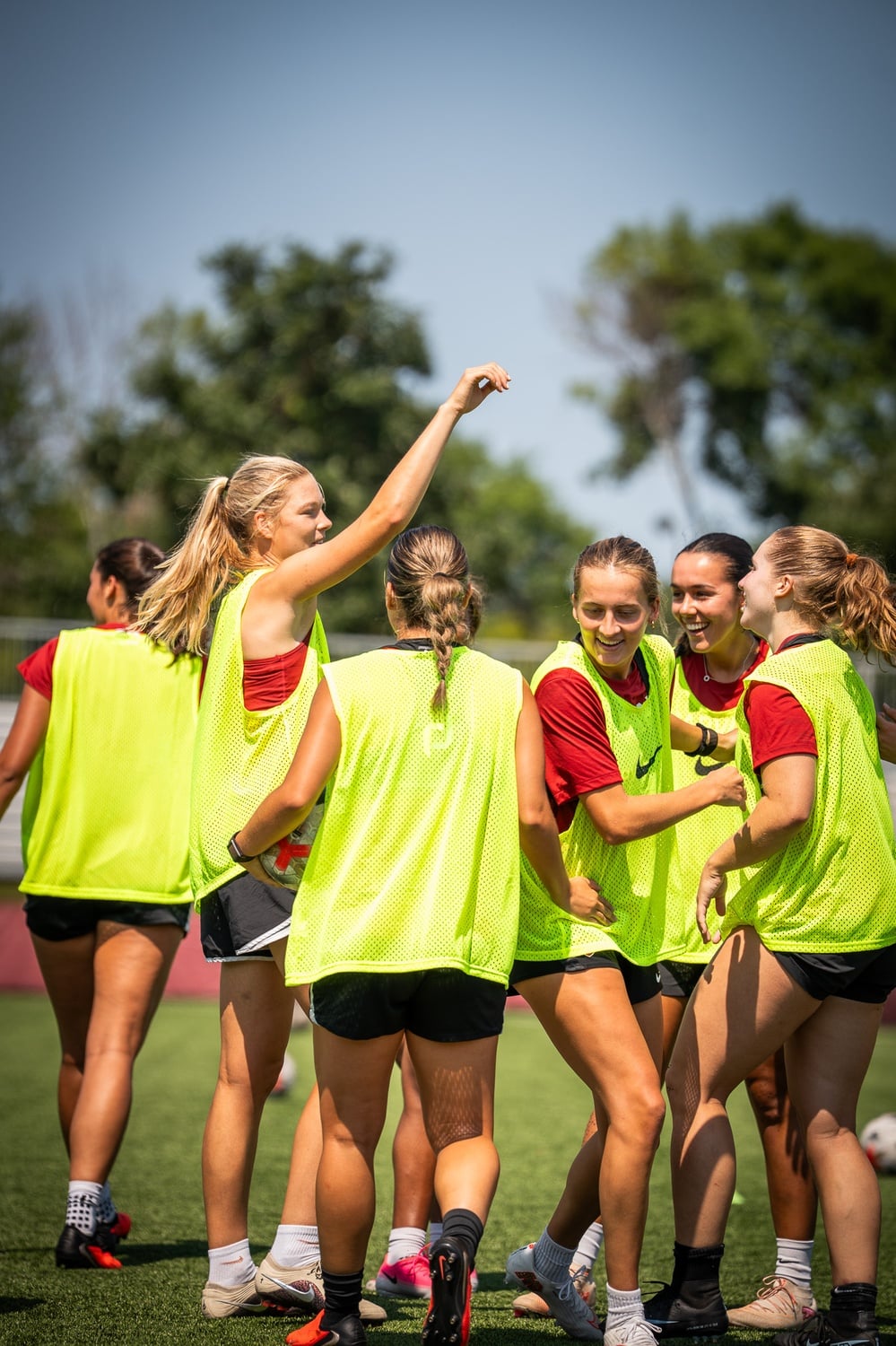 The current women's soccer team laughs during a practice this August. 