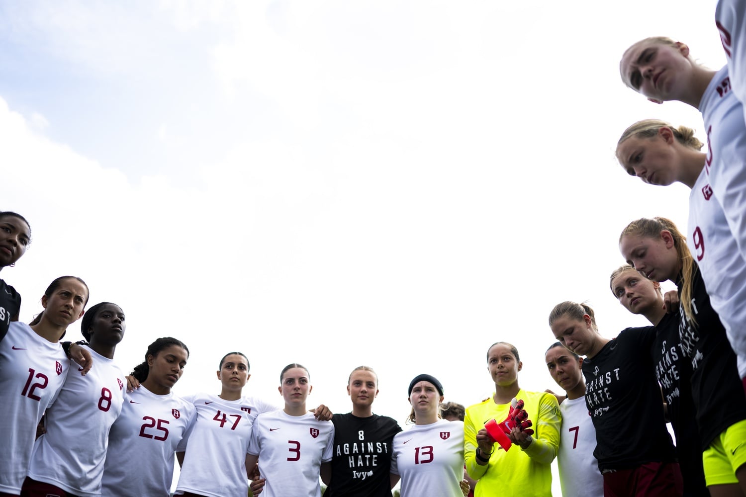 The 2025 Harvard women's soccer team huddles before a game against the University of New Hampshire. Today, the Crimson fell in a 2-1 nail-biter to Stony Brook University in its season opener.