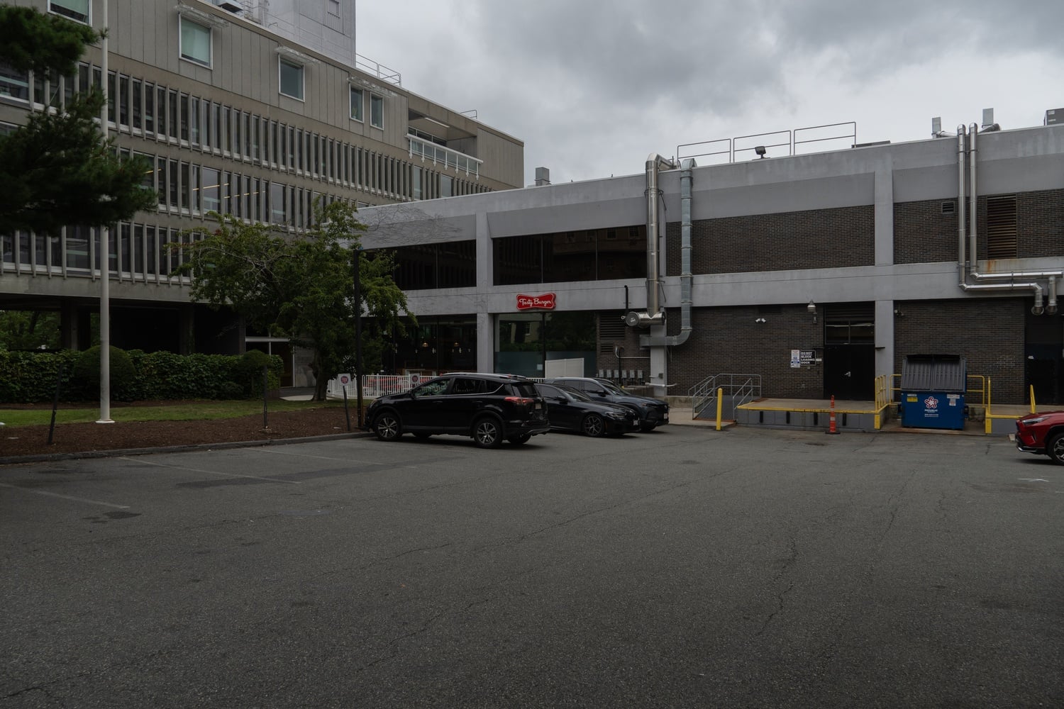 A parking lot on Temple Street in Central Square. Cambridge police fatally shot 64-year-old Watertown resident William Woodworth there Friday night after he allegedly pointed a loaded gun at responding officers.