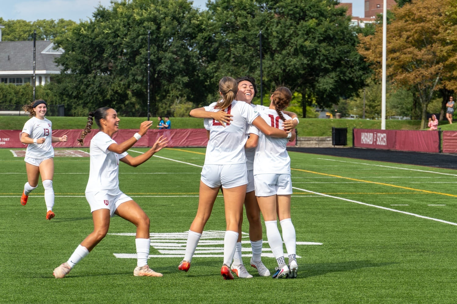 Harvard's women's soccer team celebrates its 4-0 win over the Fairfield Stags.