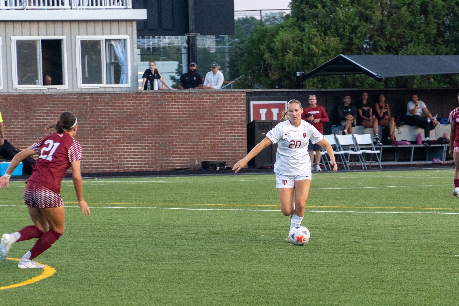 Harvard senior midfielder Anya Van Den Einde advances the ball for the Crimson.