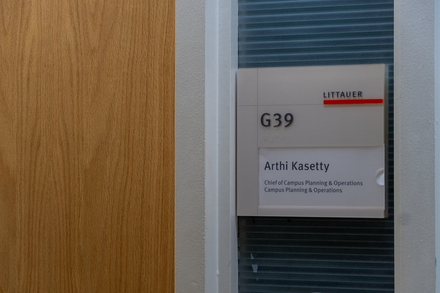 A nameplate identifies Arthi Kasetty as chief of Campus Planning and Operations at the Harvard Kennedy School.