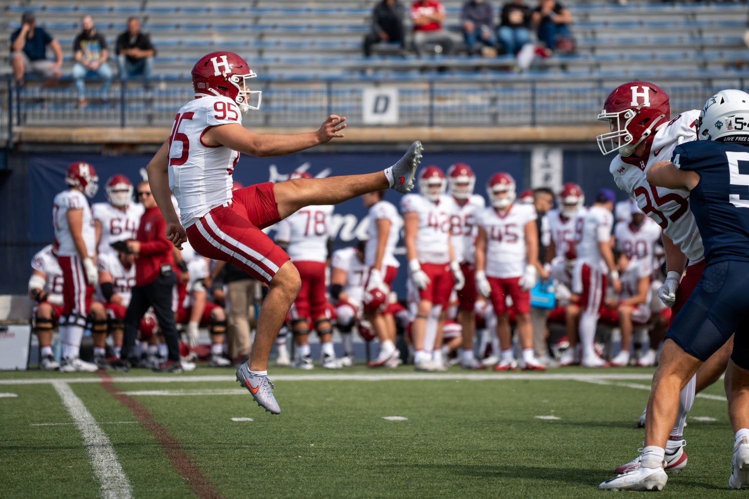 Sophomore Brian Checkley makes a punt against the Wildcats. 