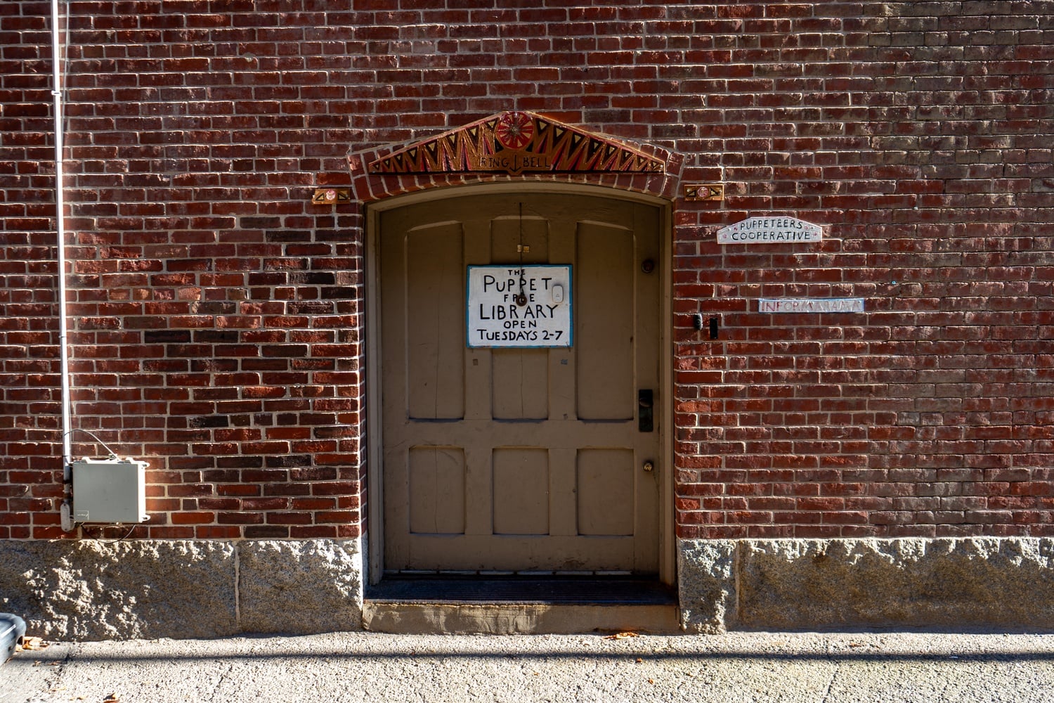The Puppet Free Library is in the basement of historic Emmanuel Church on Newbury Street in Back Bay. Visitors to the library enter from the alley.