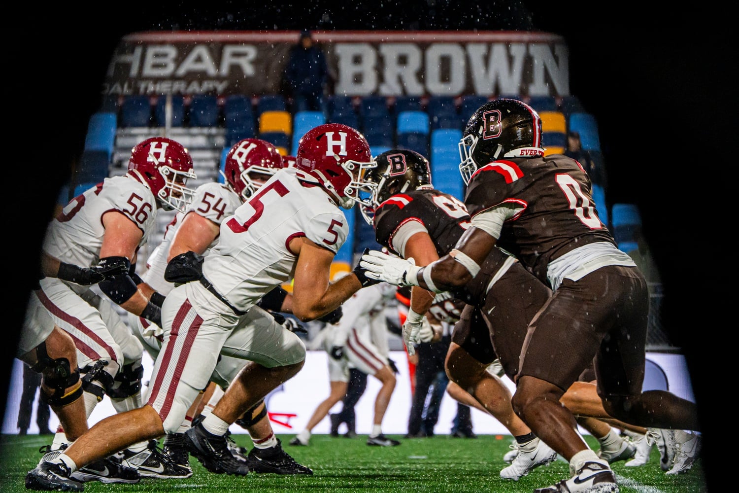 Harvard and Brown face off at Centreville Bank Stadium in Pawtucket, R.I., braving heavy rain and winds from the approaching Nor’easter.