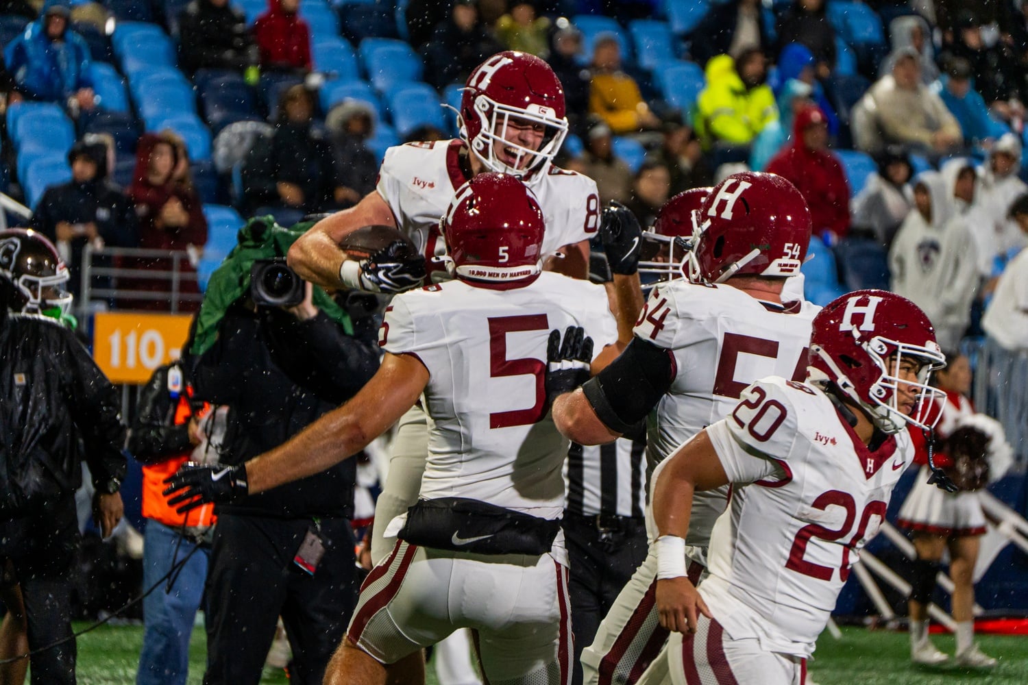 Harvard celebrates its win over the Brown Bears at Centreville Bank Stadium in Pawtucket, R.I. 