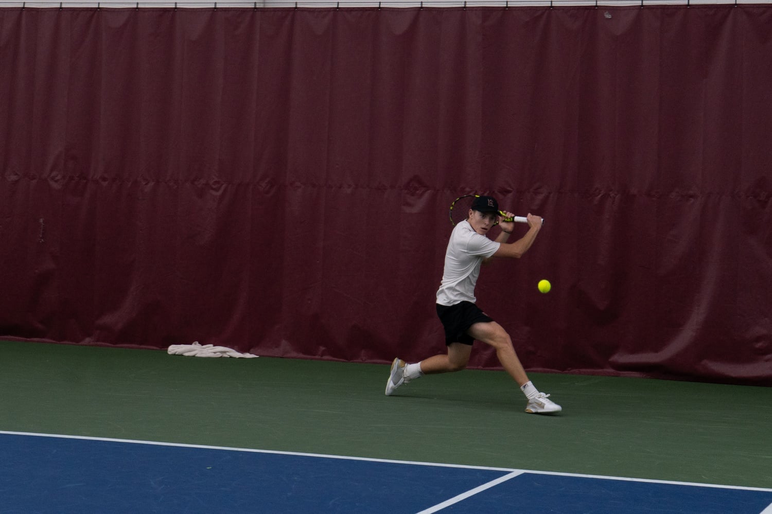 Nathan Blokhin winds up for a backhand during a match against North Carolina State in the spring of 2026. 