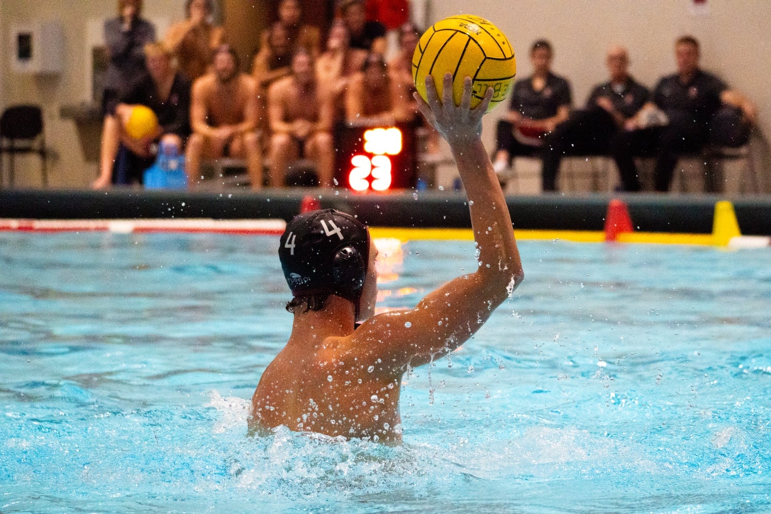 Then-freshman Tyler Hogan passes the ball during a water polo match in 2024.