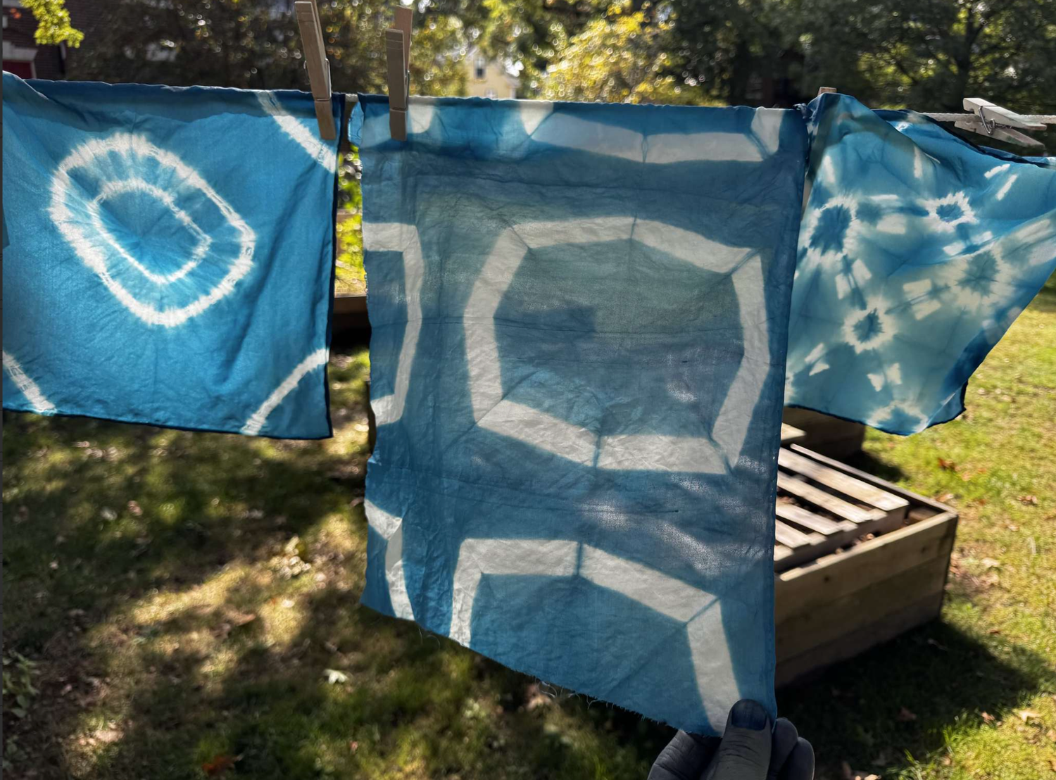 Dyed silk hangs to dry at Quad Garden Workshop.