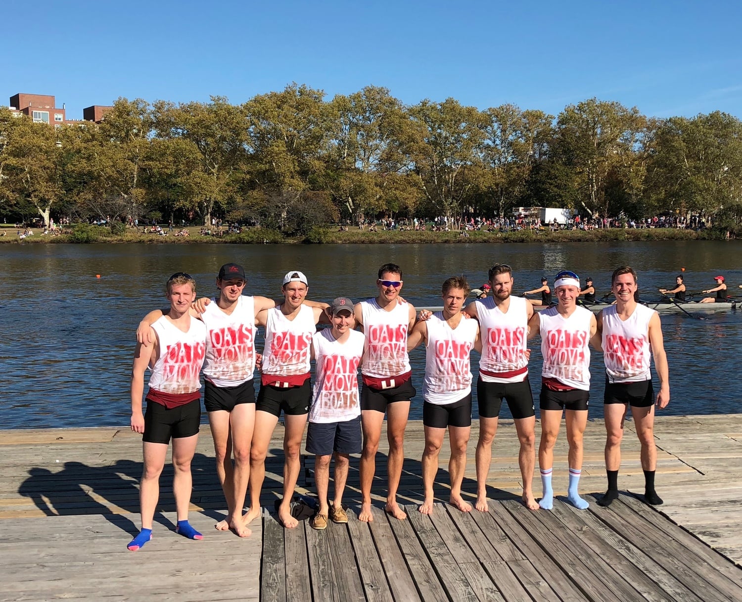 William Newell '11 poses with his crew on the dock.
