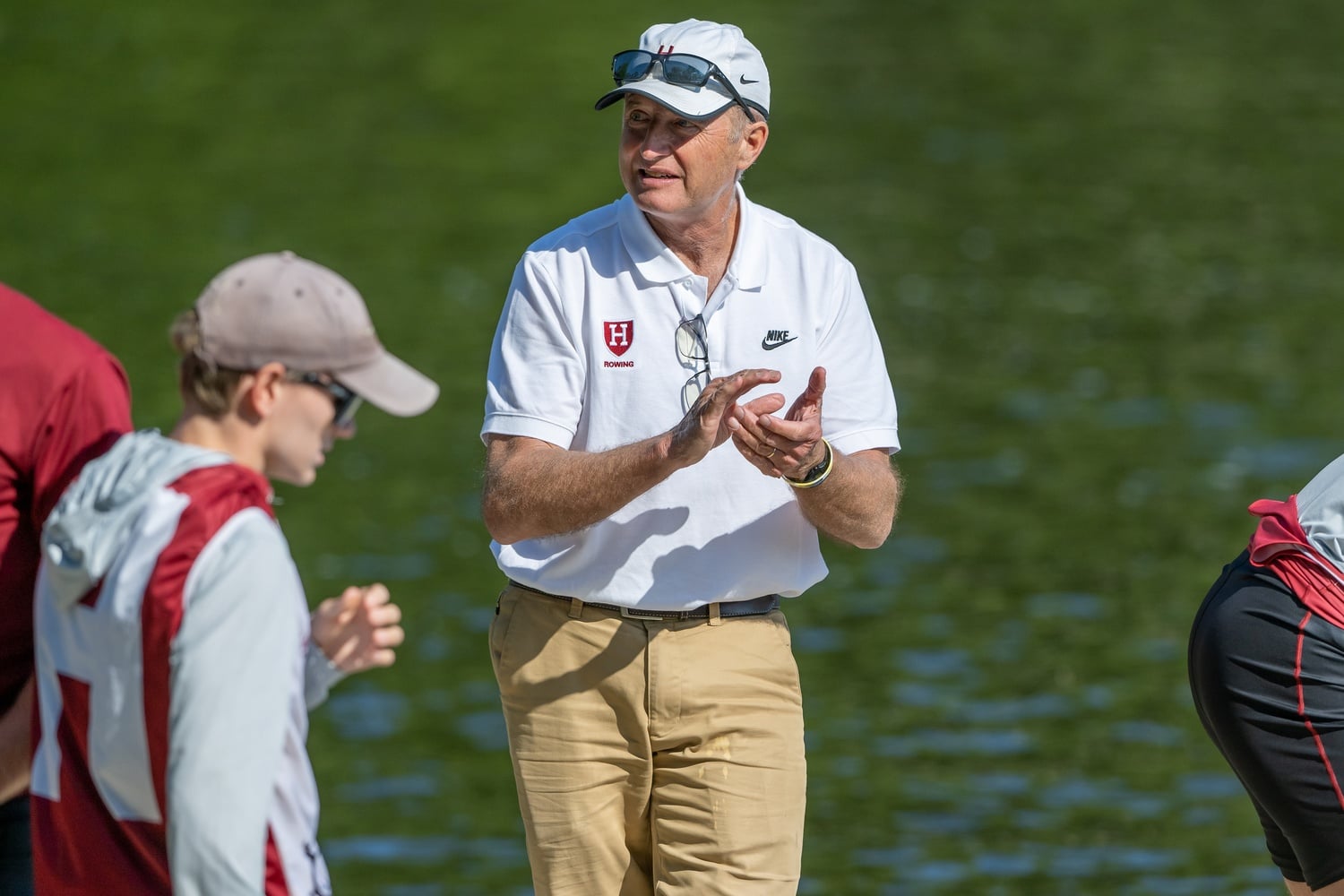 Charley Butt, the men's heavyweight crew head coach, cheers on his rowers. 