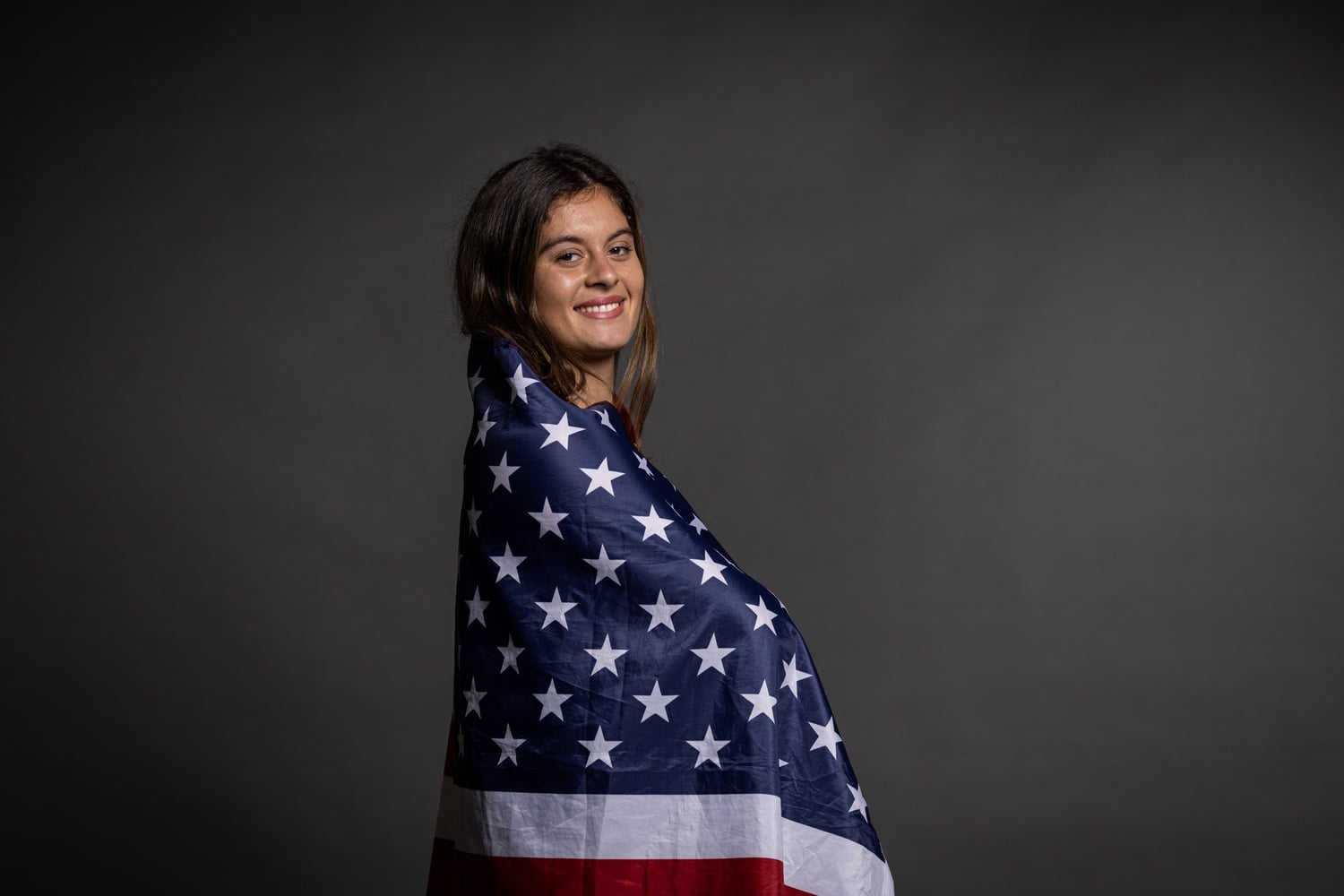 Kathryn Serra poses with the American flag.