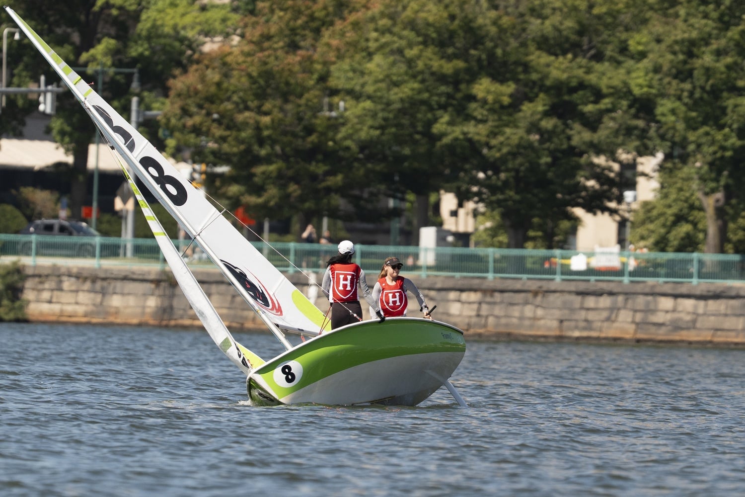 Seniors Zoey Ziskind and Christina Chen race for Harvard's sailing team.