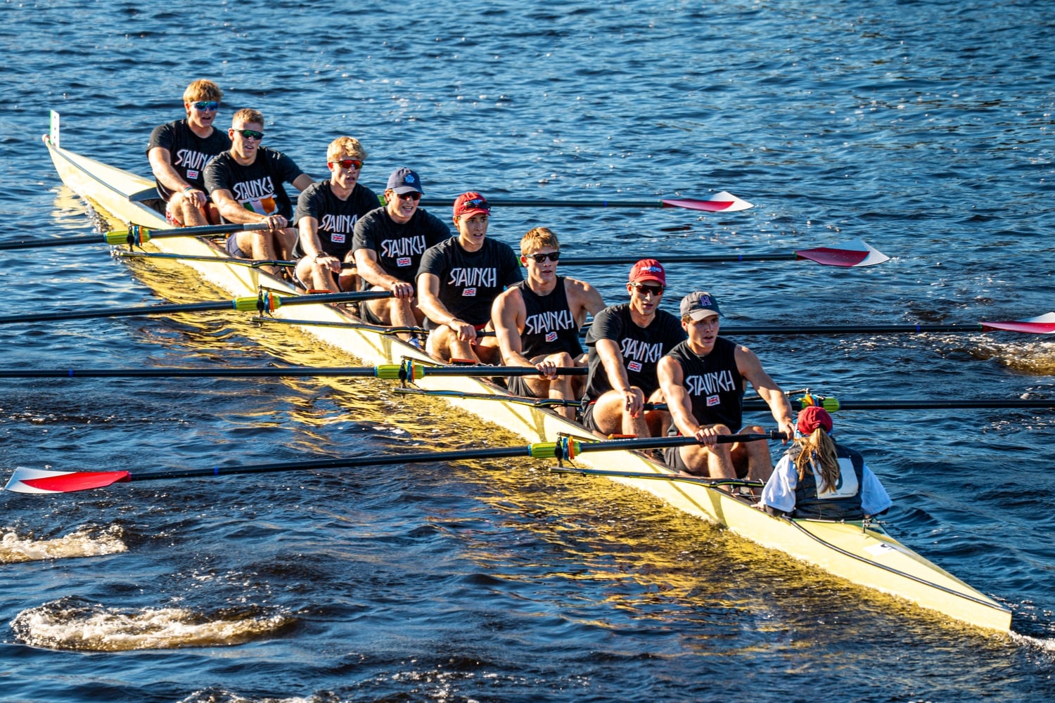 Harvard heavyweight Championship B boat barrels under Anderson Memorial Bridge. 